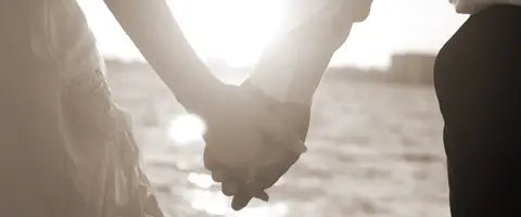 Couple holding hands with lab grown diamond engagement ring after proposal by Quorri