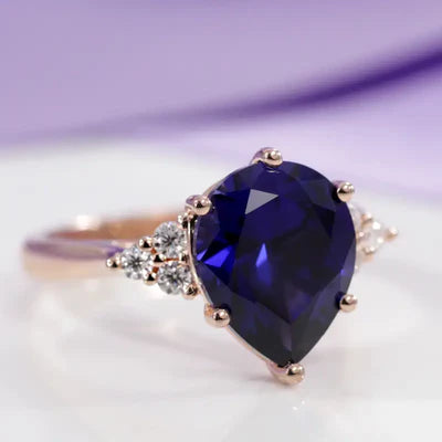 Gemstone engagement rings at Quorri featuring large blue lab grown sapphires and lab diamonds