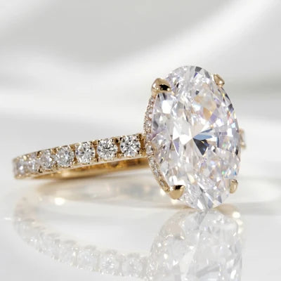 oval lab diamond with hidden halo and accents in yellow gold