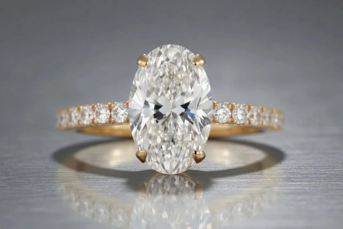 oval lab grown diamond with accents in yellow gold