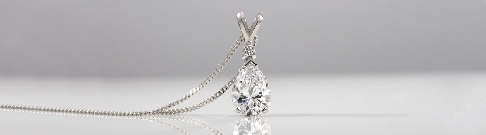 white gold 3 carat lab grown diamond pear pendant with gold chain Quorri
