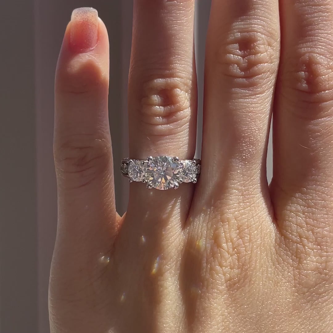 designer Vera Wang inspired lab diamond accented three stone round engagement ring