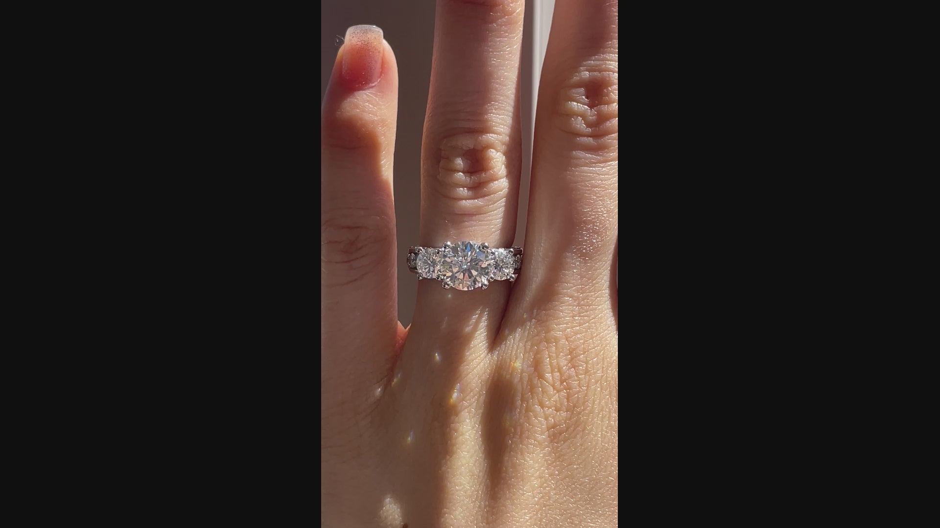 designer Vera Wang inspired lab diamond accented three stone round engagement ring