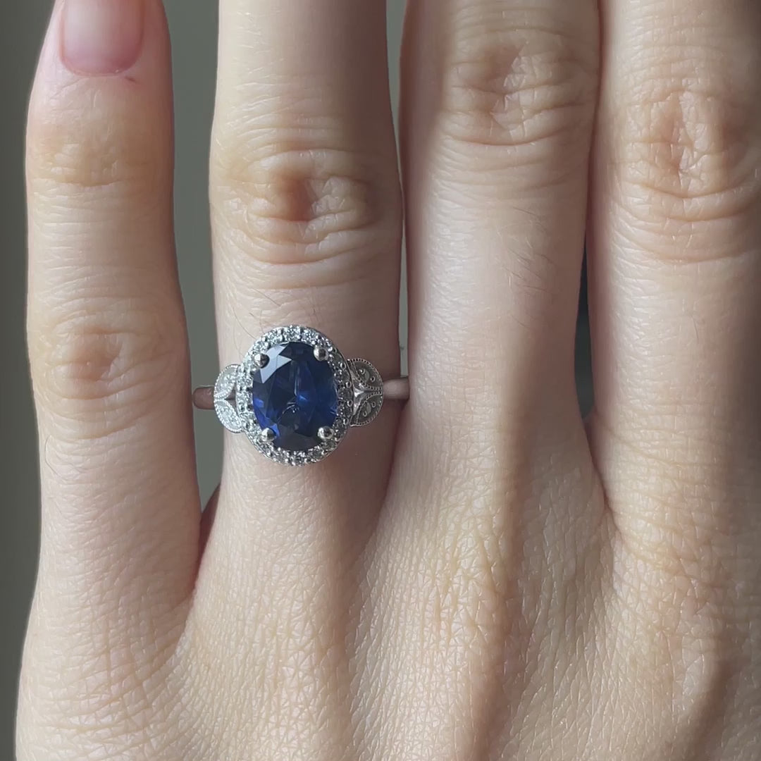 18k white gold lab grown 4.5 carat blue sapphire halo and petal engagement ring Quorri Canada