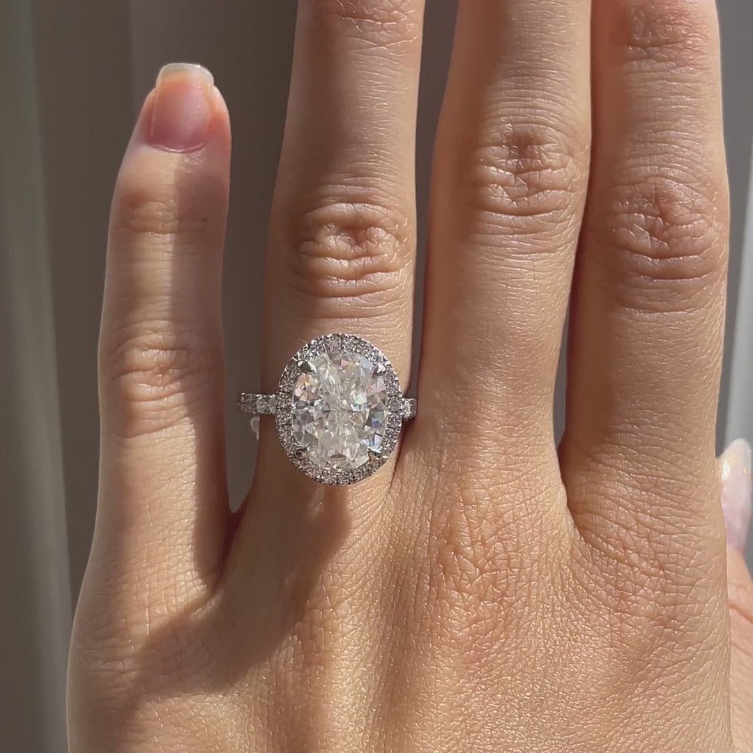 designer white gold three-sided accented band 4 carat oval halo lab made diamond engagement ring Quorri