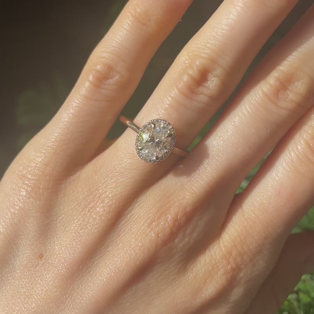 2 carat oval lab diamond halo engagement ring with claw prongs in 14k yellow gold at Quorri Canada