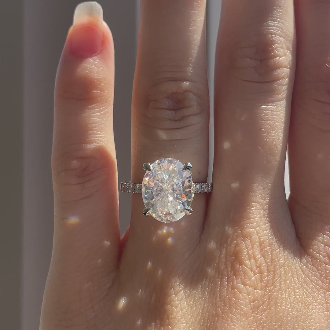 4 carat 18k white gold designer hidden halo claw prong oval lab diamond engagement ring Quorri Canada