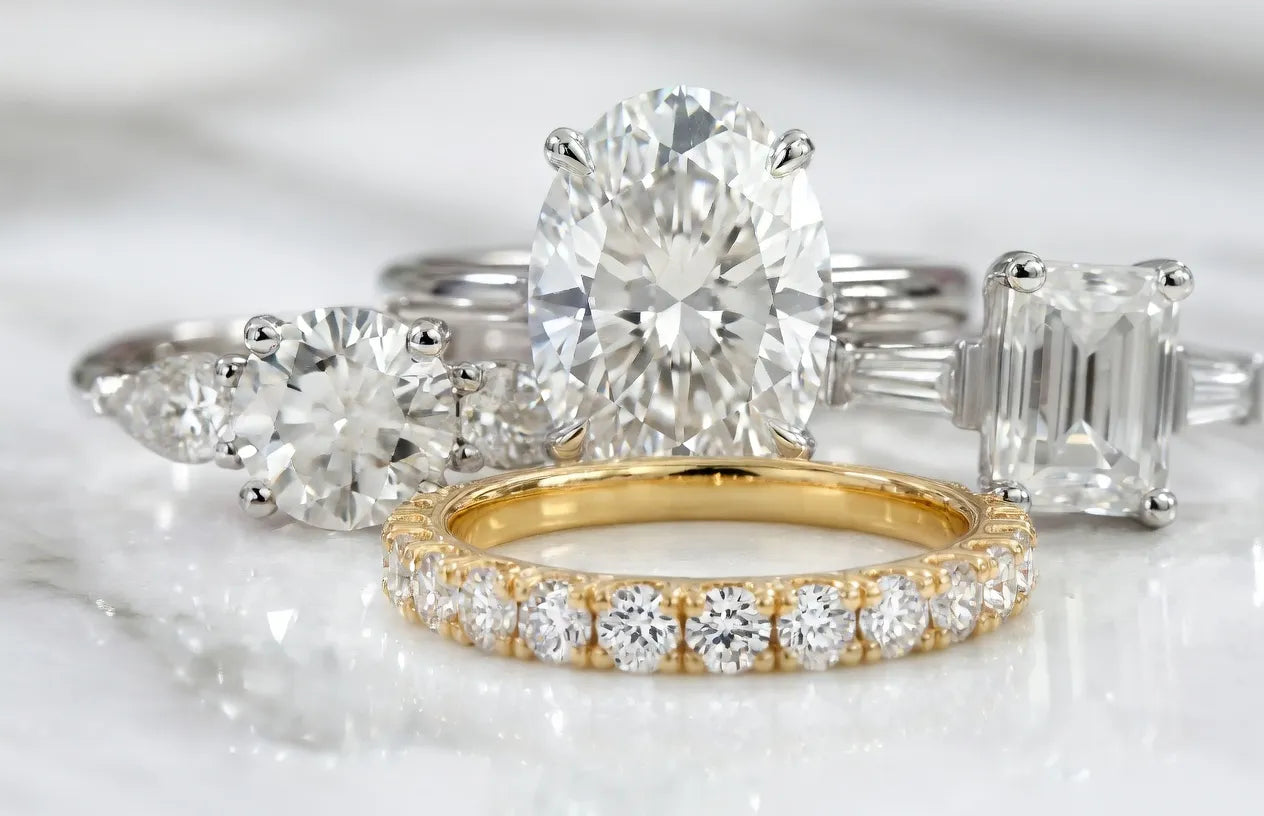 Ready to ship Quorri lab diamond rings showcasing oval, three stone, emerald and eternity wedding band
