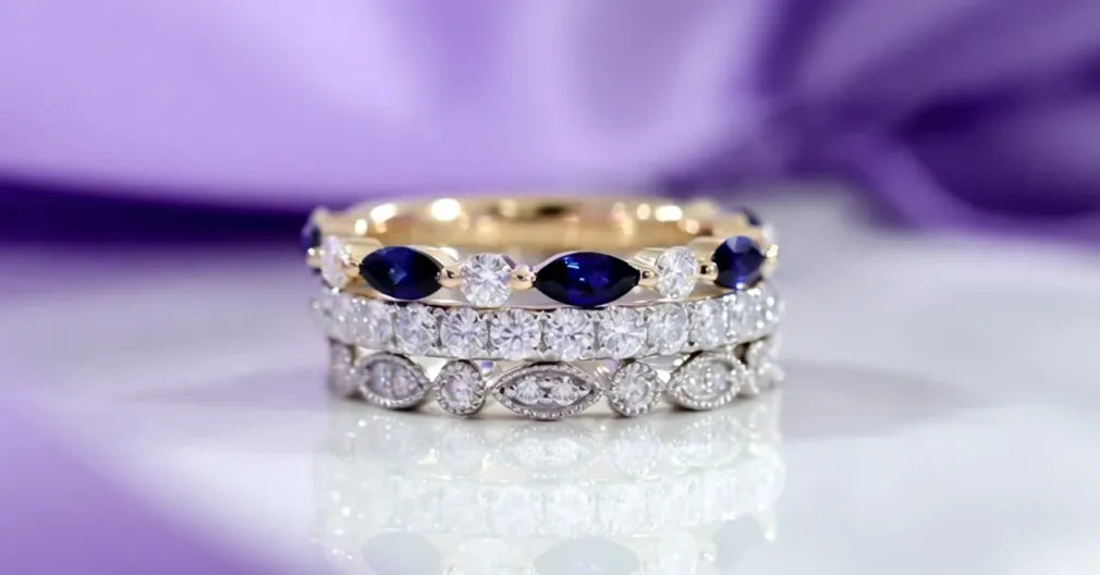 lab diamond and sapphire wedding bands in gold stacked together - Quorri
