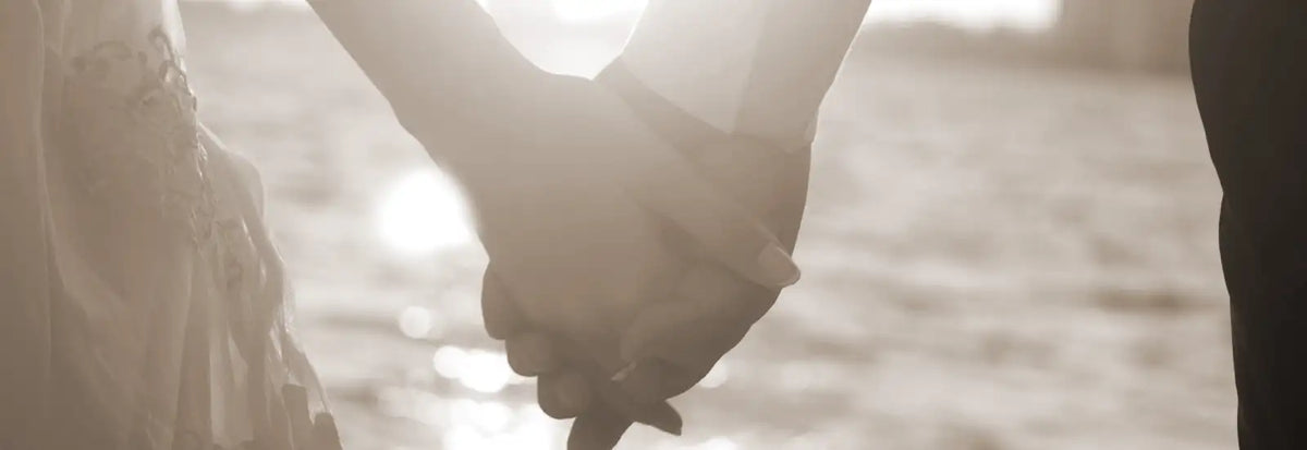Couple holding hands with lab diamond engagement ring by Quorri