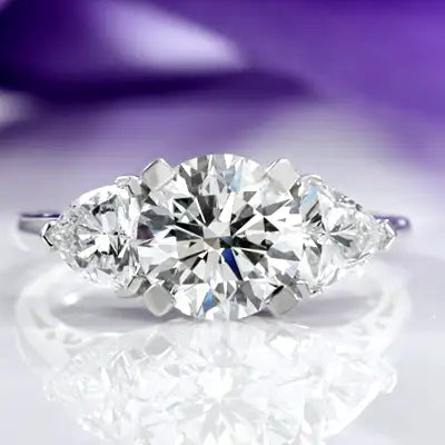 white gold three stone round and pear lab diamond engagement ring