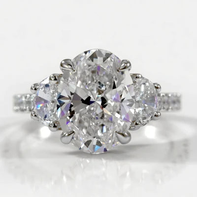 three stone oval and trillion ring