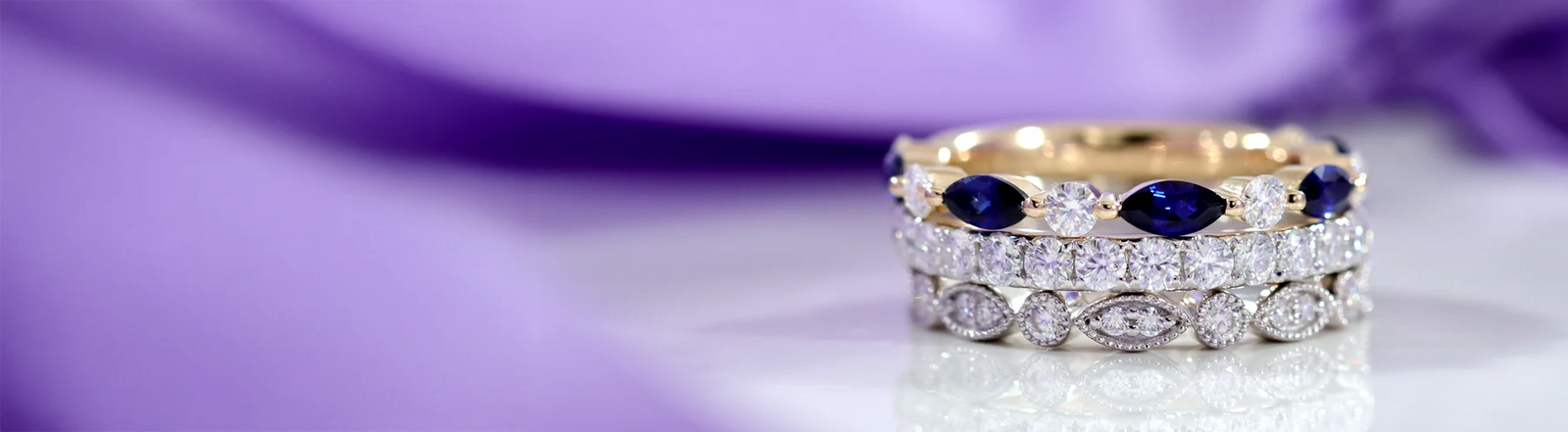 sapphire with diamond, full eternity and round brilliant stacked wedding bands