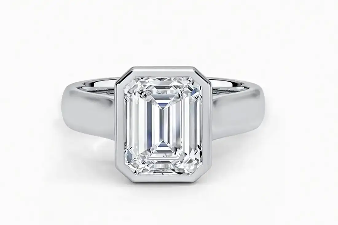 wide platinum band 3 carat emerald lab diamond solitaire ring, front facing 
- Quorri