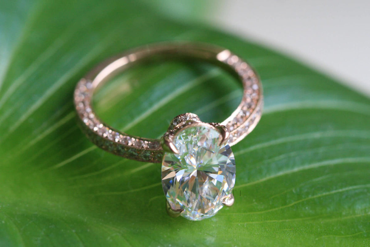 three sided band rose gold claw prong oval engagement ring