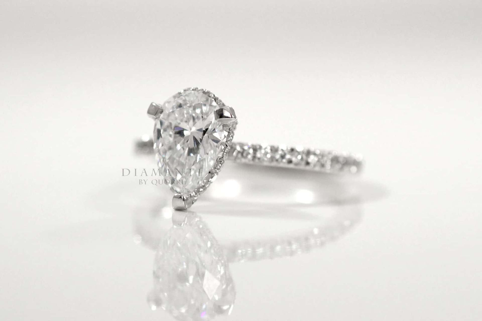 moissanite pear under halo diamond ring